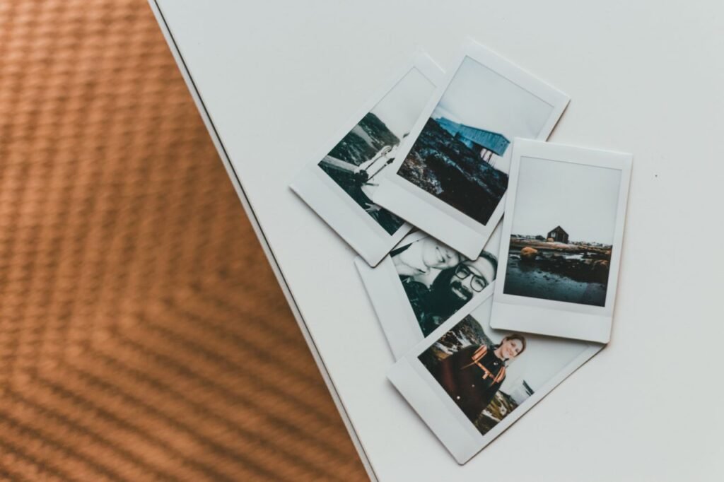 A collection of Polaroid photos creatively arranged on a modern table.